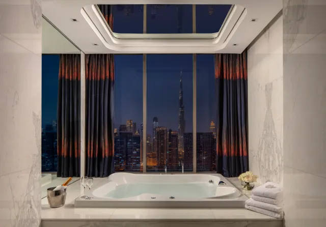 image of bathroom at night with a dark blue view of the sky in the background