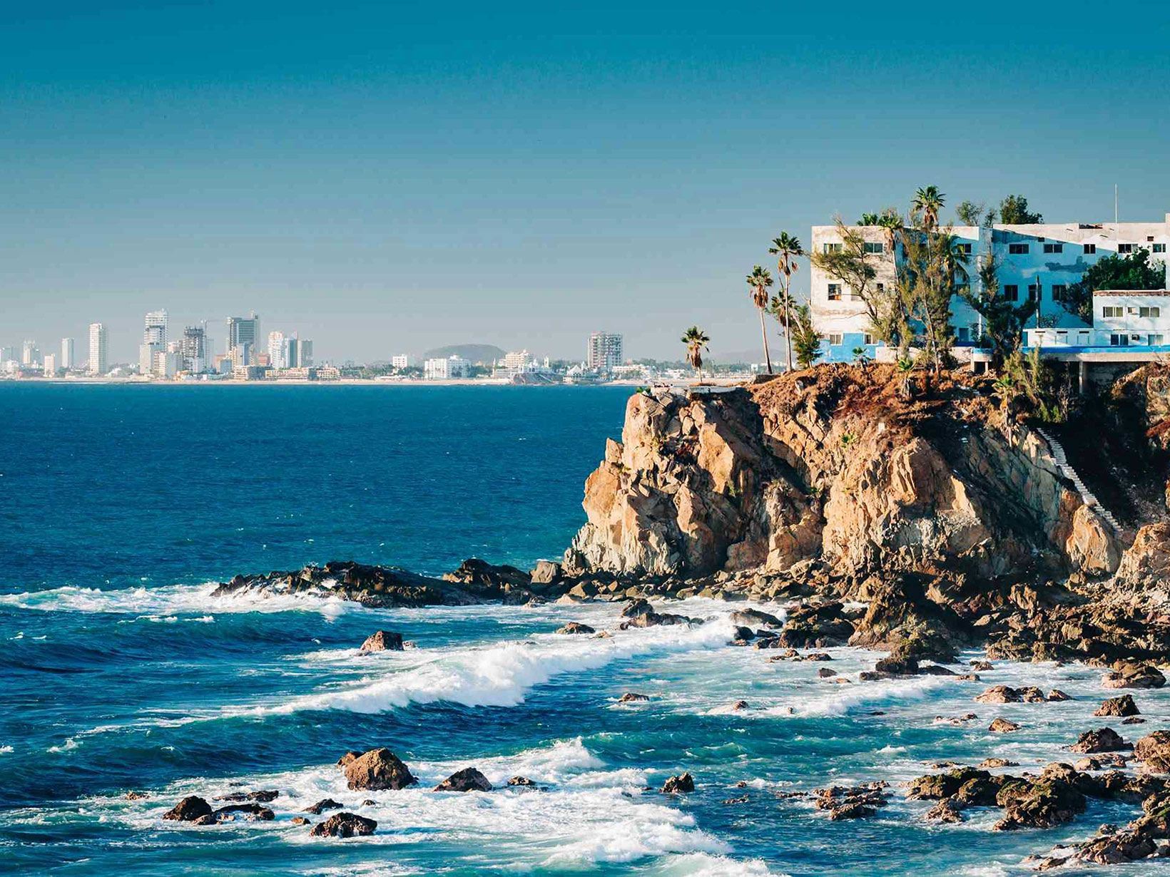 Beautiful vista of the ocean waves splahsing against the cliff near Hyde mazatlan hotel